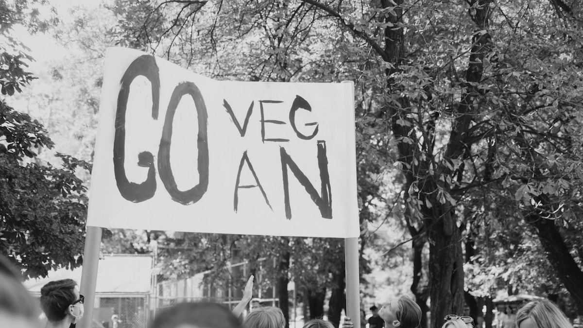 Vegan protestor holding a sign